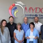 Community partners and Home Bank come together to provide a new HVAC system for the MYDC
